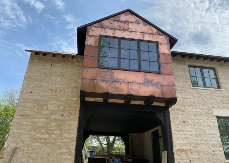 Copper metal panel facade on a stone building for Metal Roof Coating in Apple Valley